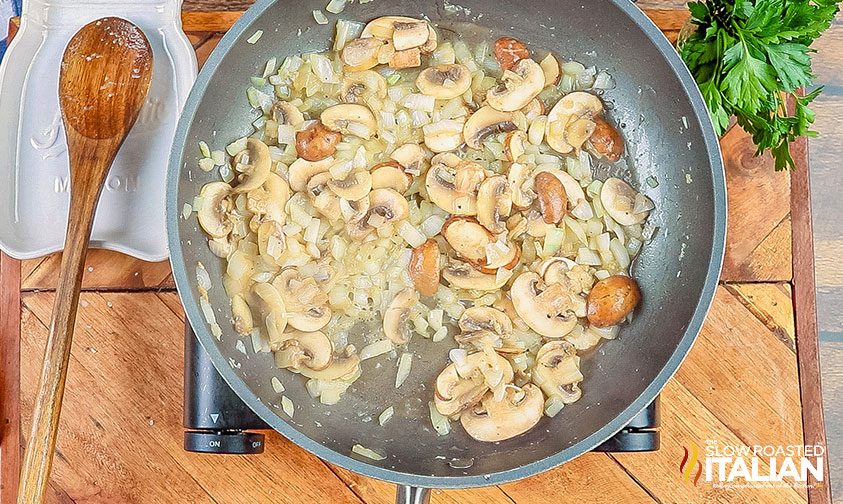 onions and mushrooms cooking in pan