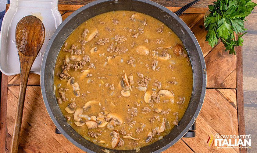 beef stock ground beef and mushrooms cooking in pan