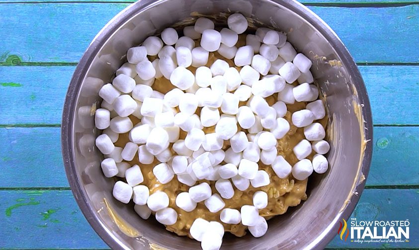 rice krispie and caramel mixture with marshmallows on top