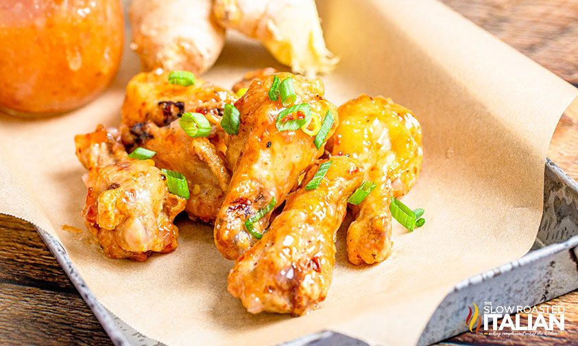 sweet and spicy chicken wings on parchment paper