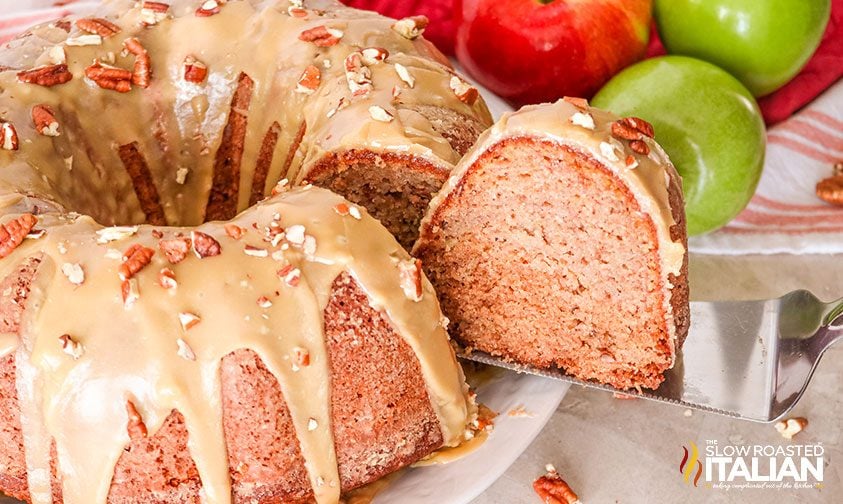 a slice of Caramel Glazed Apple Bundt Cake being taken