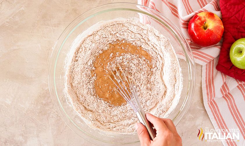 apple bund cake mixture with flour in it