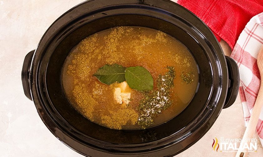 chicken stock with garlic and bay leaves