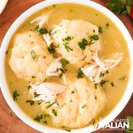 overhead: bowl of bisquick dumplings with shredded chicken and gravy