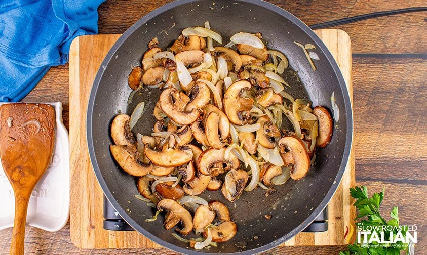 mushrooms and onions cooking in skillet