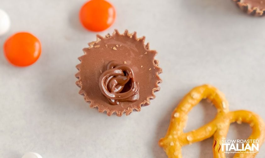 reese's with chocolate drizzle and a pretzel