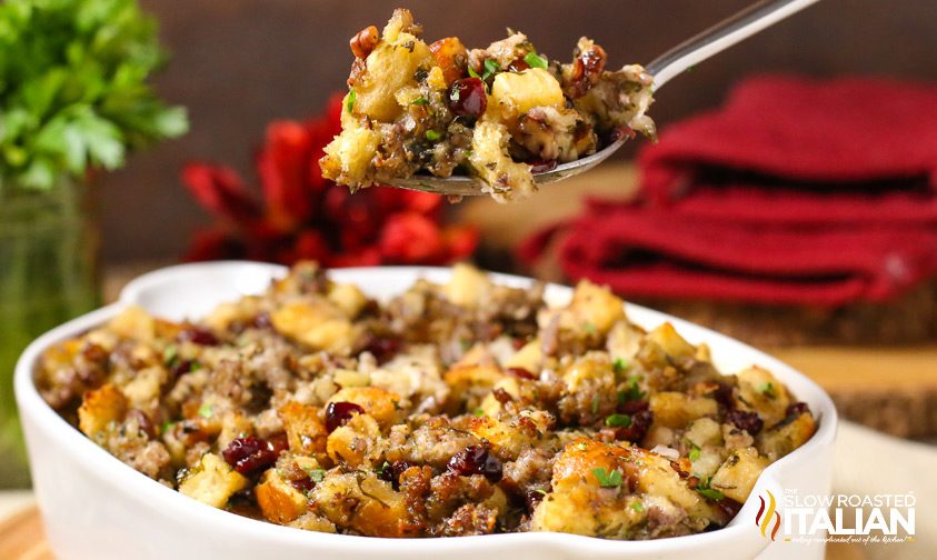 stuffing in white bowl with spoon hovering over