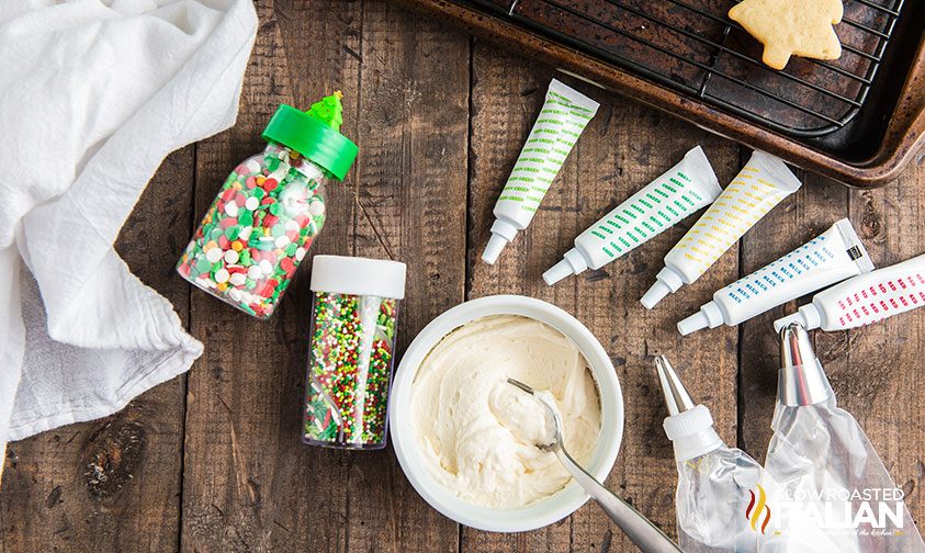 sugar cookie icing in bowl with sprinkles in containers