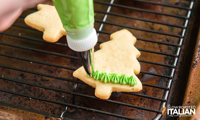 icing tree shaped sugar cookie with green frosting