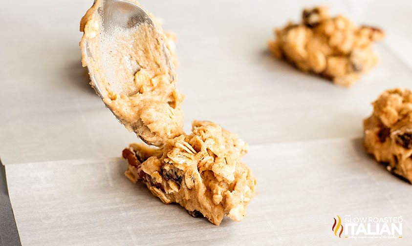 forming applesauce cookie balls on parchment