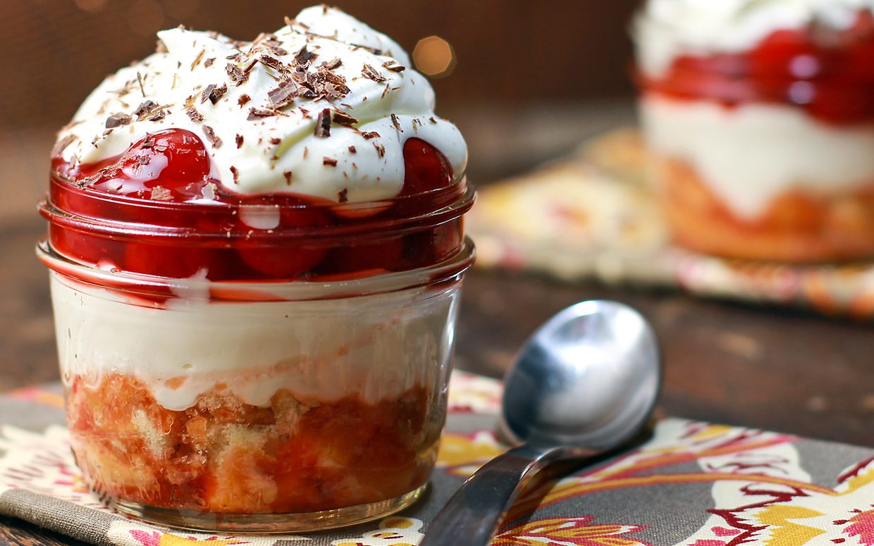 Chocolate Cherry Tiramisu in a mason jar with a spoon