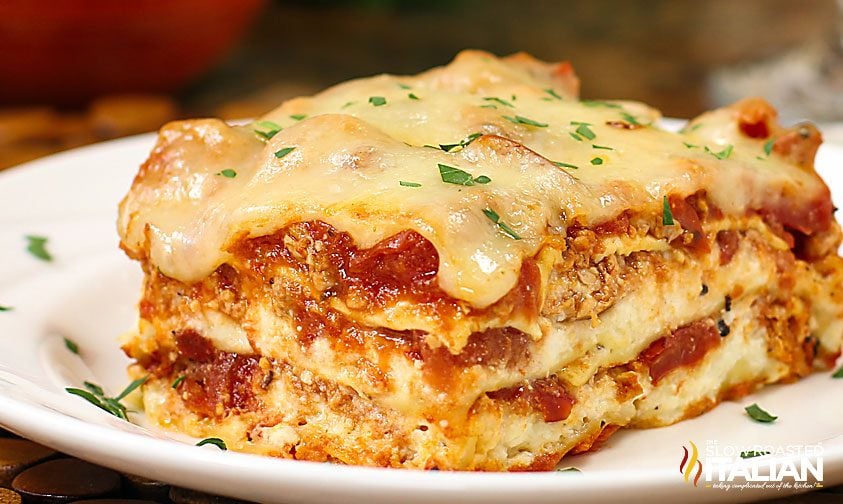 lasagna cut into a square on white dinner plate