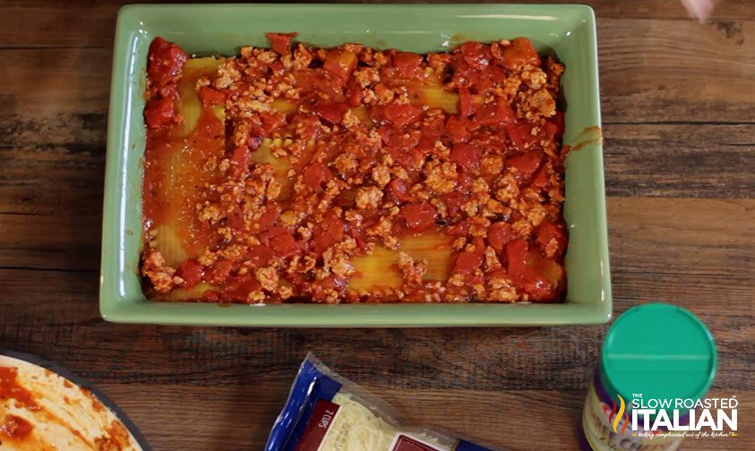 lasagna almost fully assembled in square pan