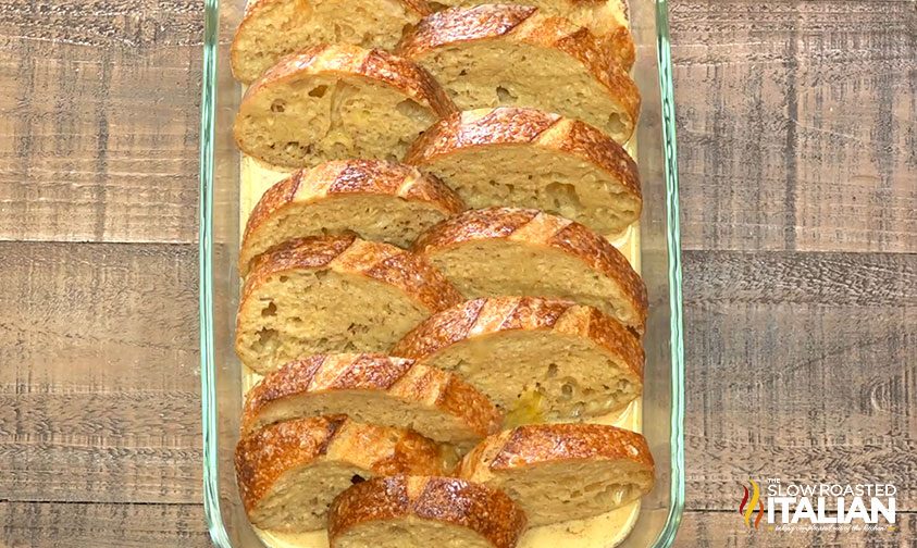 french toast in glass pan with egg mixture