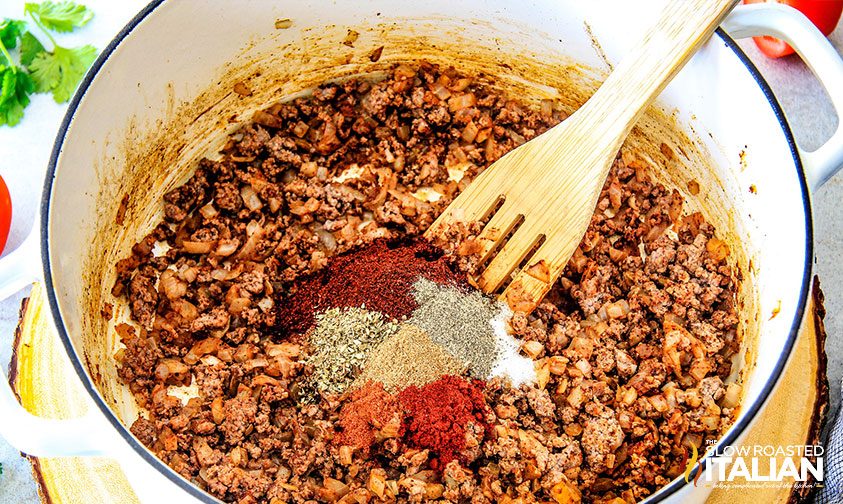 taco meat in pot with wooden spoon