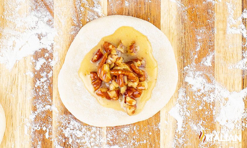 dough with pecan mixture spread on top