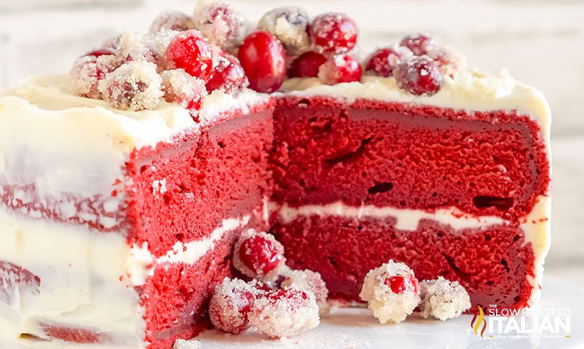 red velvet christmas cake with a chunk cut out