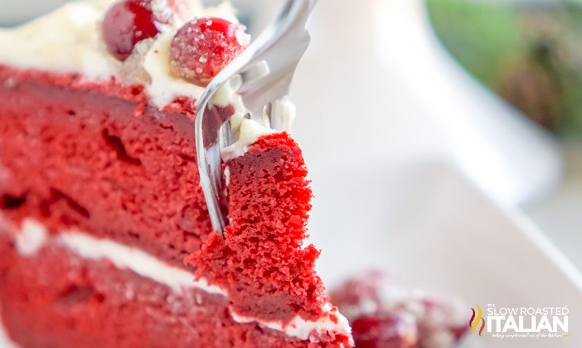 fork taking out a chunk of red velvet christmas cake