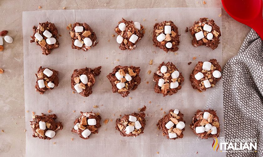 crockpot candy balls arranged on parchment paper