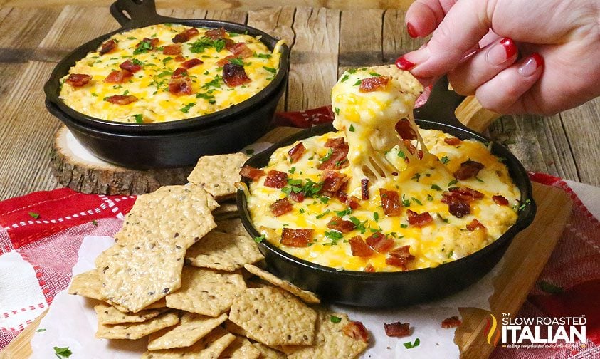 two mini cast iron skillets filled with cheesy jalapeno dip