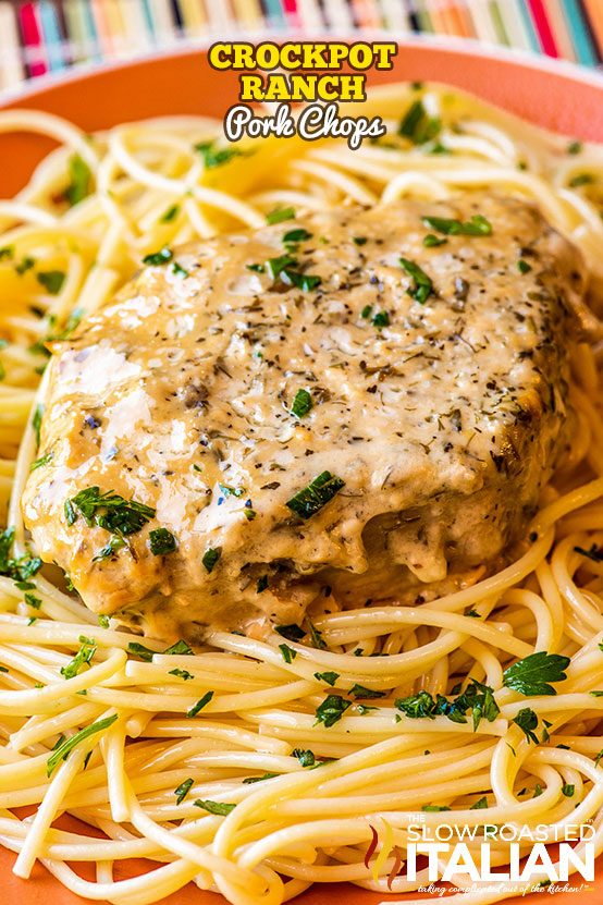 crockpot ranch pork chops on plate of spaghetti