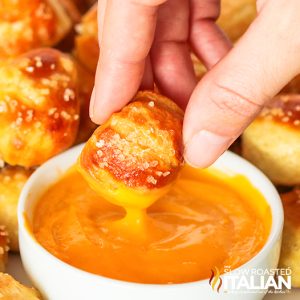 dipping soft pretzel bites in sauce