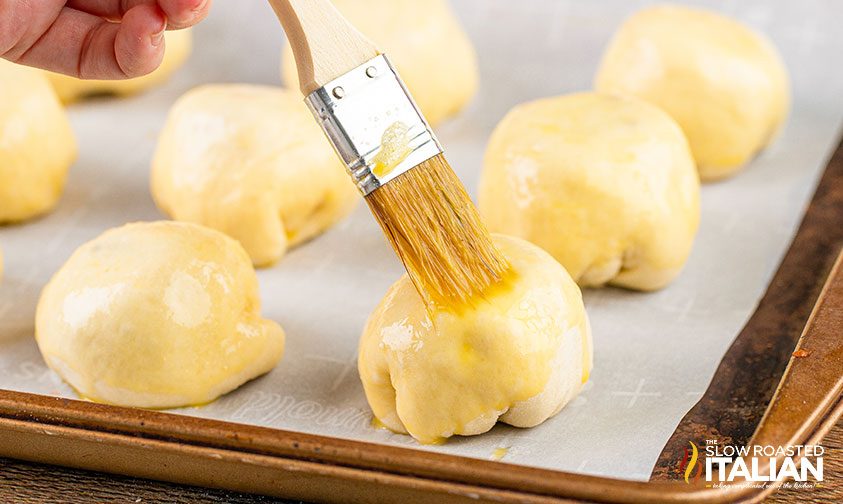 brushing bread bombs with egg wash