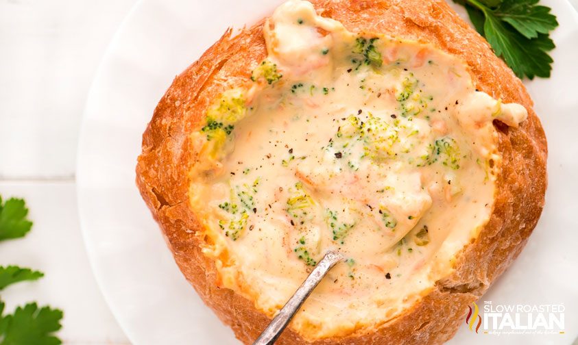 overhead photo looks down into bread bowl filled with creamy soup