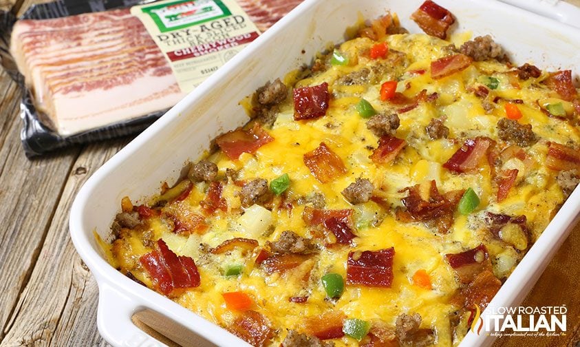 baked eggs with sausage, bacon, cheese, and hash browns in casserole dish