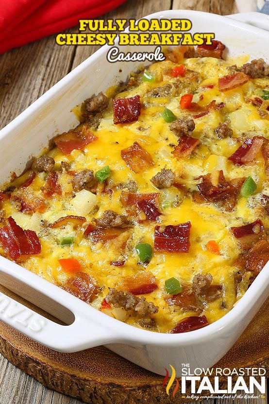 fully loaded baked egg casserole in white casserole dish