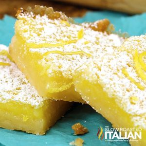 stack of lemon bars dusted with powdered sugar
