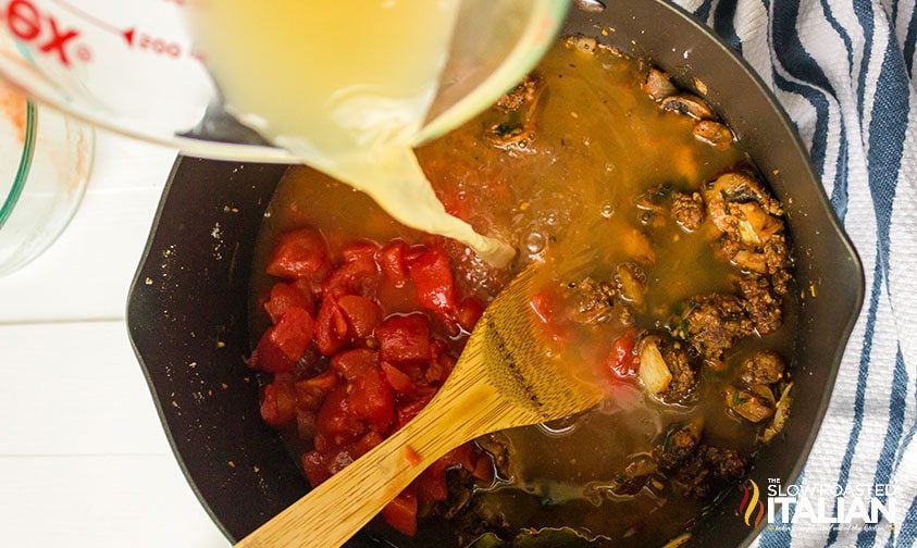 adding chicken broth to one pot pasta