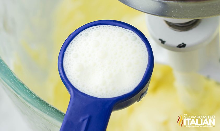 adding milk to stand mixer