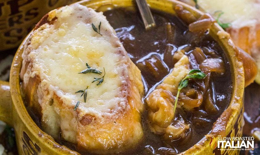crockpot french onion soup in bowl with cheesy crouton