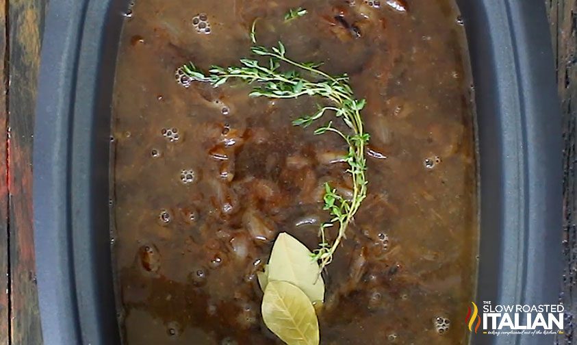 topping soup with herbs