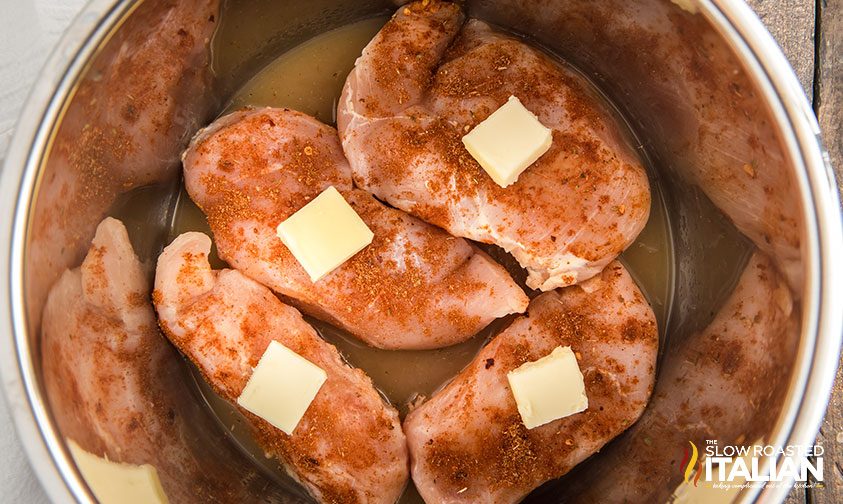 cooking frozen chicken in an Instant Pot with butter on top