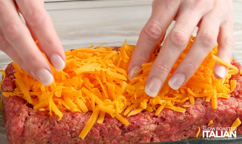 Adding cheese to the bottom half of the meatloaf