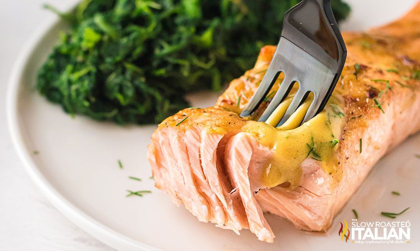 fork cutting into air fry salmon