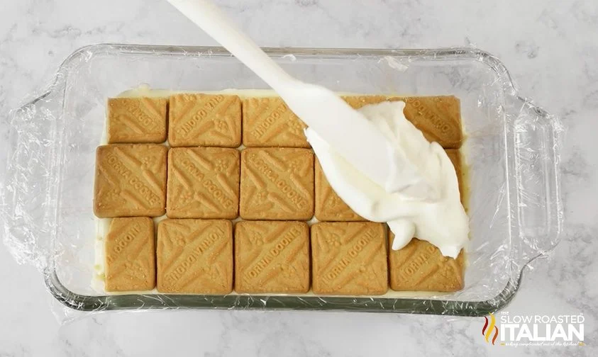 Cookie layer topped with cream