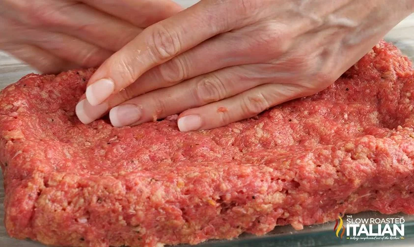 Forming the bottom half of the meatloaf