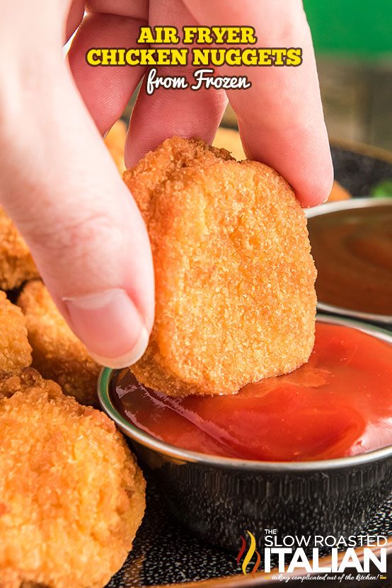 Air Fryer Chicken Nuggets dunked in sauce