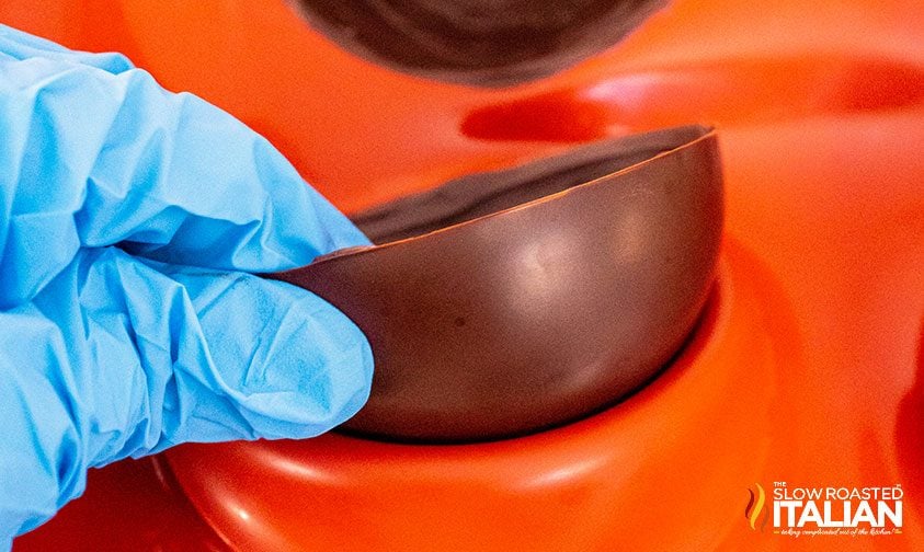 removing the chocolate from the mold