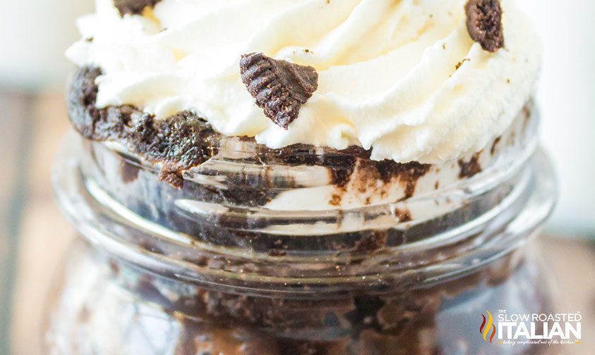 Oreo mug cake with whipped cream on top