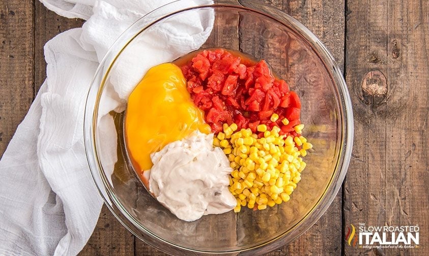 combining ingredients in a bowl for hamburger casserole