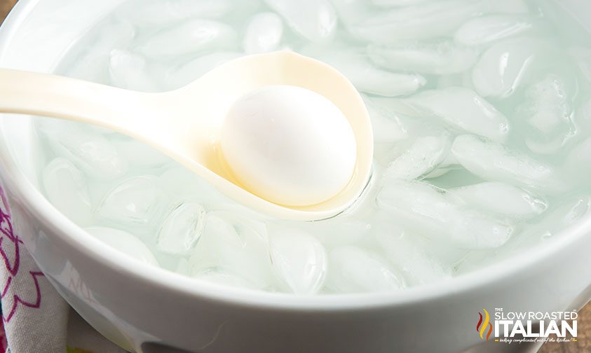 putting hard cooked egg in ice water bath