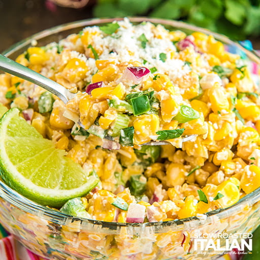 Mexican street corn salad in clear glass bowl