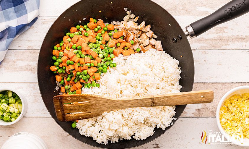 overhead: pork stir fry with rice in skillet