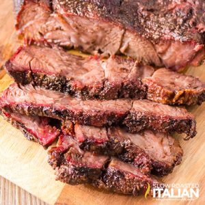 sliced smoked chuck roast on cutting board