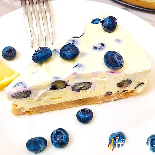 slice of no bake lemon cheesecake with blueberries