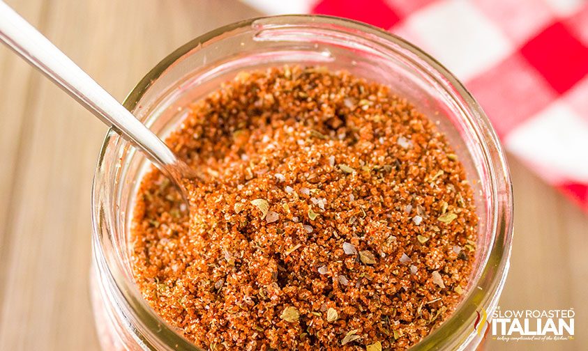 Sweet BBQ Rub in a mason jar with a spoon